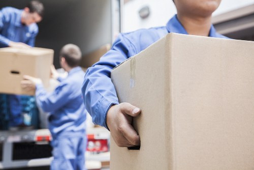 Removal team sorting recyclable items during an Acton clearance