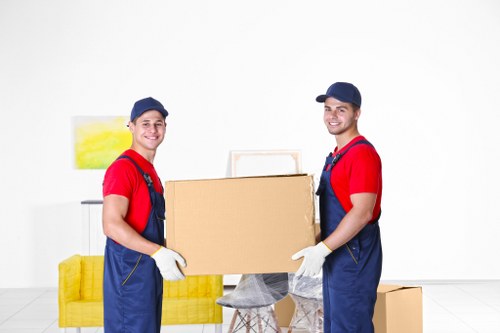Student removals team handling boxes in Acton outside a residential property
