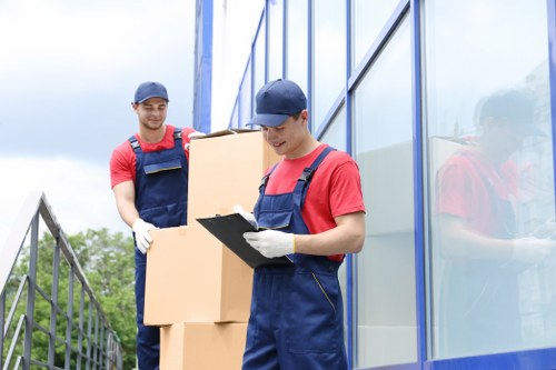 Removal van and movers planning a residential move in Acton