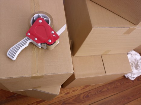Organised office move planning with desks, files, and IT equipment ready for transport