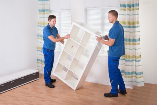 Careful furniture handling during a local flat removal in Acton