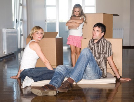 Furniture and boxes being loaded for a house move in Acton